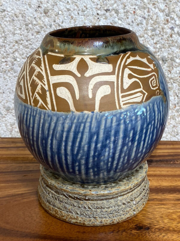 This beautiful porcelain round vase is inspired from the Lapita pottery of the ancient Polynesians (who were potters). The vase is decorated with Polynesian motifs