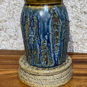 This tall large porcelain vase is good for a bouquet with its wide opening and its large base it won't blow over easily. Decorated in relief and glazed with Huahine glazes.