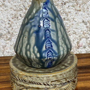 Small porcelain vase that has a very beautiful stable shape with Polynesian relief designs and Huahine glazes.